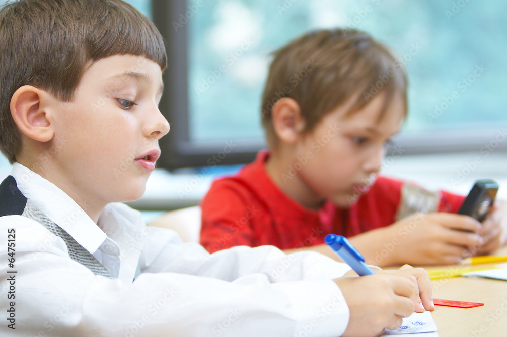 Obraz premium Pupils in a class. School change