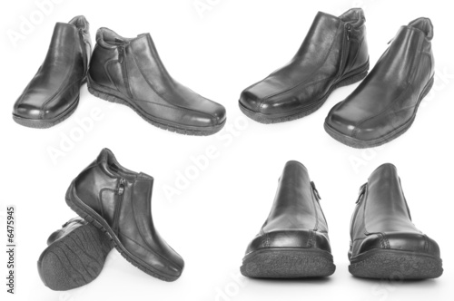Black winter shoes isolated on white with shadow