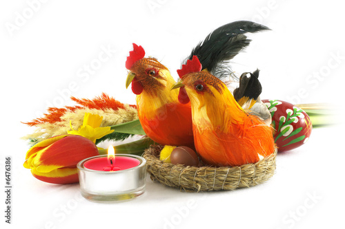 Easter colorful, joyful, decorations lighted by candle on white