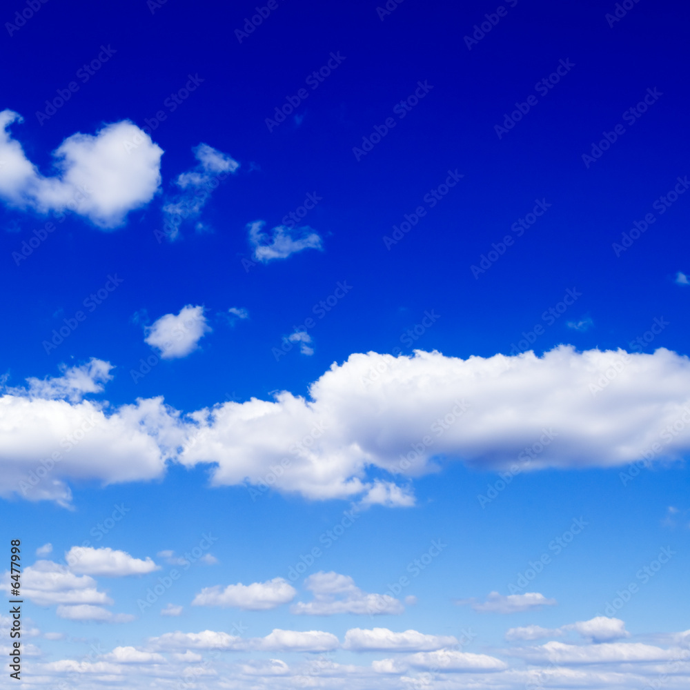 White fluffy clouds in the blue sky. White fluffy clouds in the blue sky.