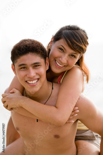 young couple having fun at the beach