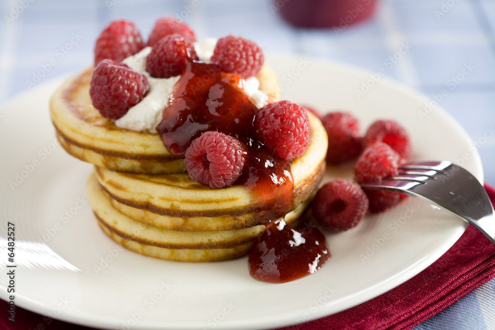 Delicious pancakes with ricotta and raspberries Delicious pancakes with ricotta and raspberries