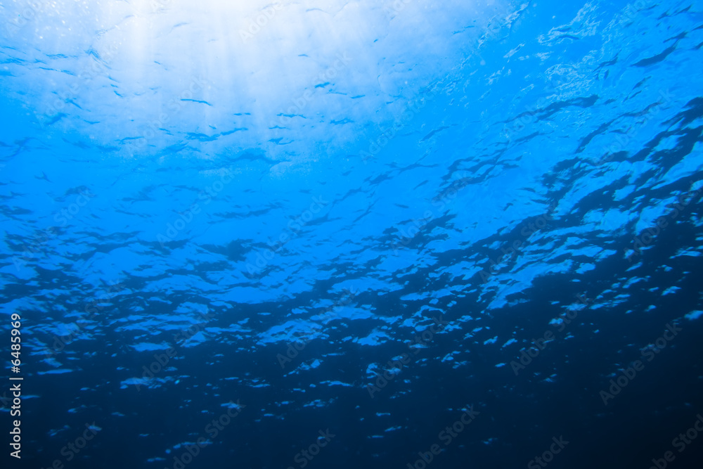Underwater scene with sunlight through the water