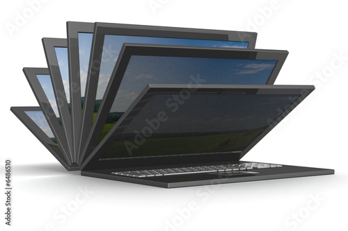 The opening laptop on a whi...