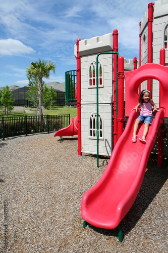 Young girl outside playing ...