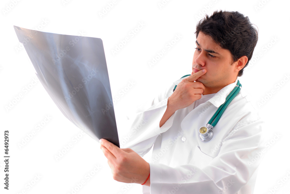 The Doctor with stesthoscope Analyzing X-Ray . The Doctor with stesthoscope Analyzing X-Ray .