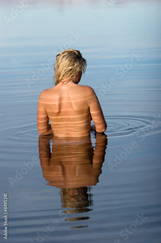 Back of a woman in water © MaxFX