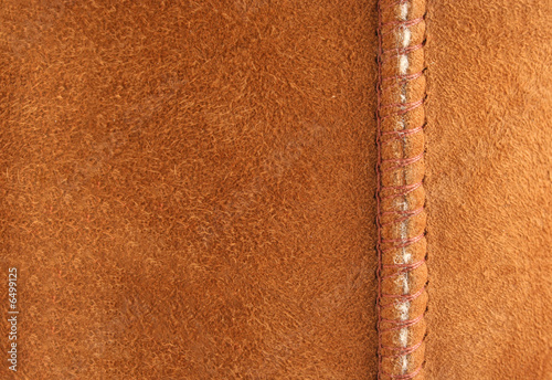 Brown suede background with seam