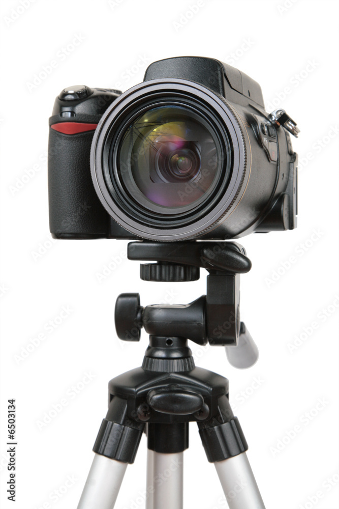 Modern photo camera on tripod 2