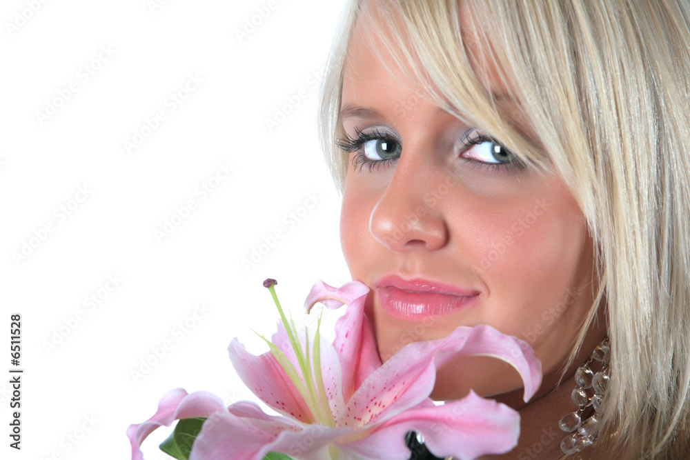 Beautiful girl holding a pink lily on white background Beautiful girl holding a pink lily on white background