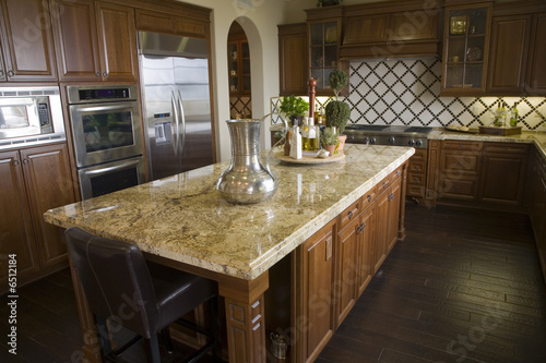 Luxury kitchen with a modern granite island.