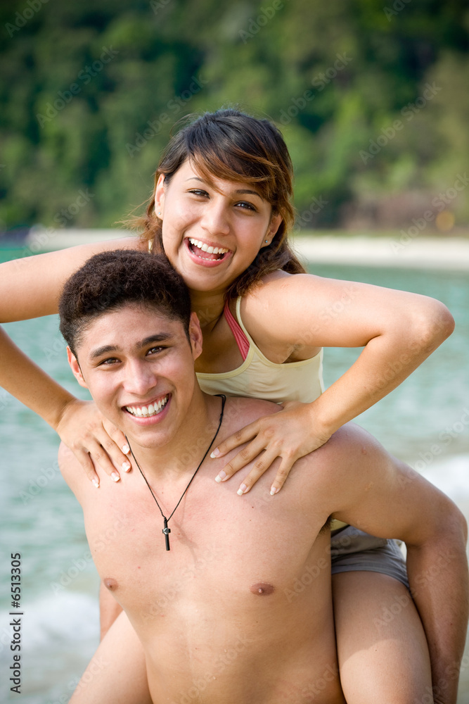 couple having fun at the tropical beach couple having fun at the tropical beach