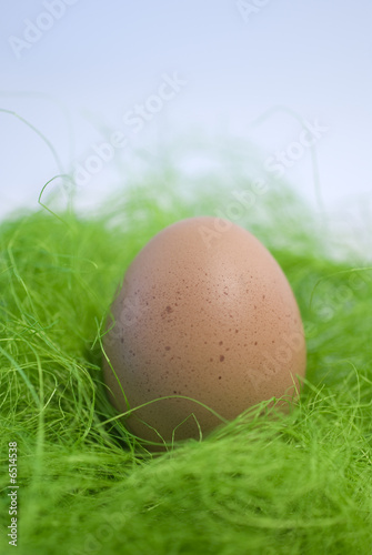 Eggs and green straw photo