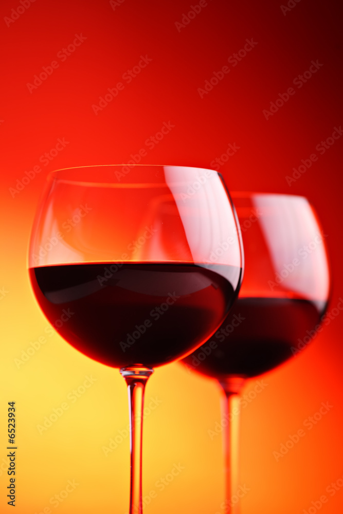 Wine glasses against red background Wine glasses against red background
