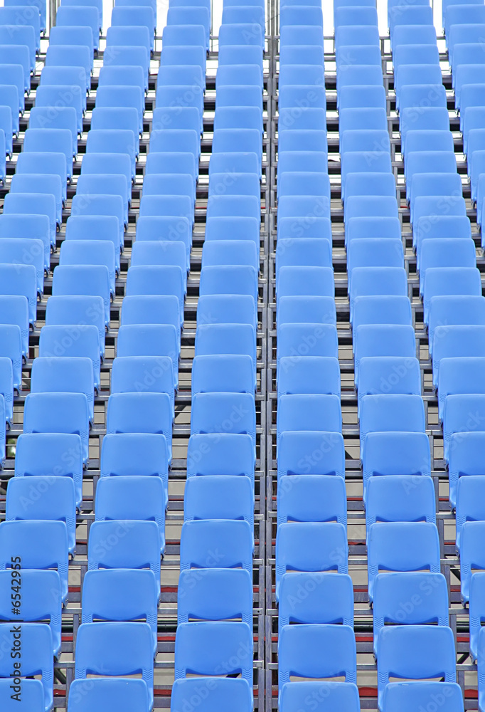 Naklejka premium Rows of blue plastic chairs