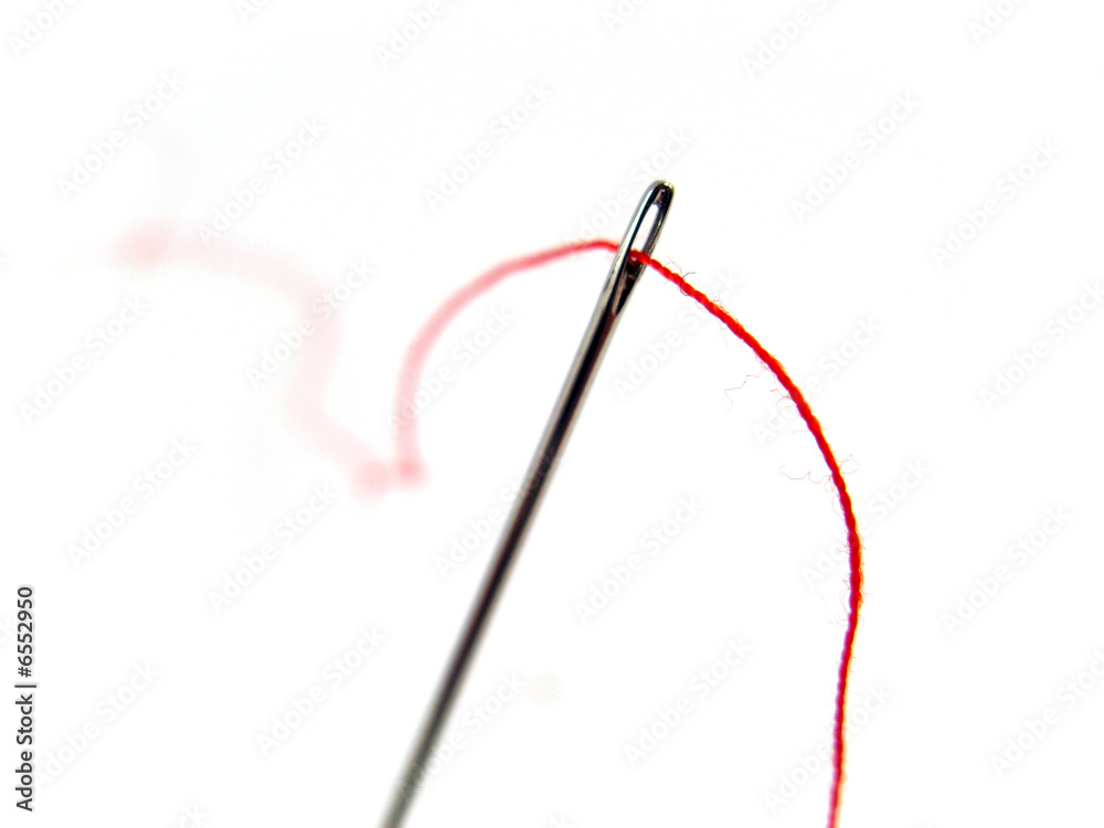 needle and red yarn