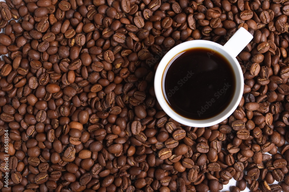 Cup with coffee, costing on coffee grain Cup with coffee, costing on coffee grain