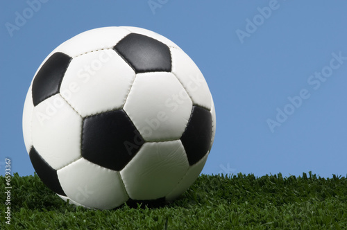 Football - Soccer ball against blue sky © Michael Flippo