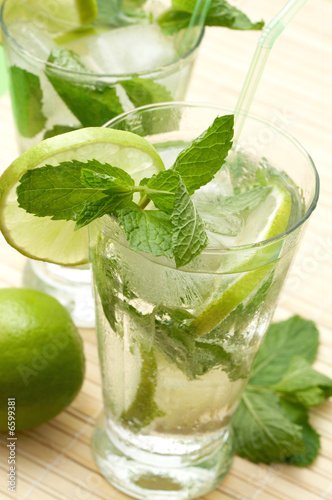 Two mojito cocktails with lime