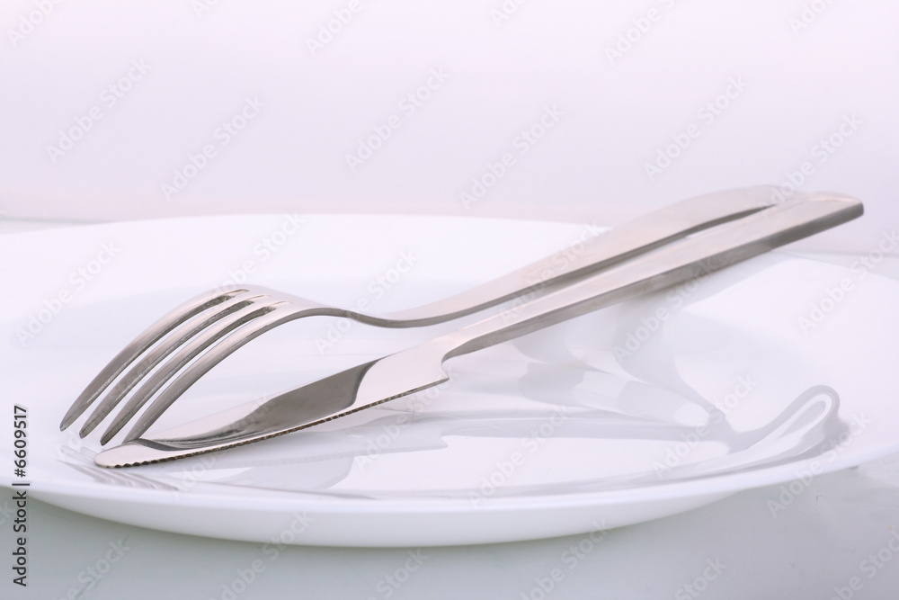 Knife and plug on a plate