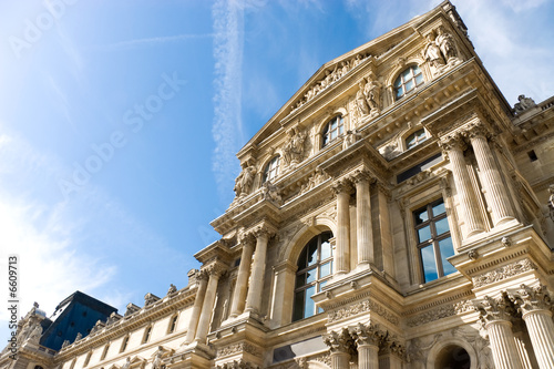 Louvre building on blue sky background © chaossart