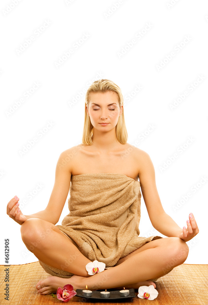 Beautiful young woman meditating isolated on white background