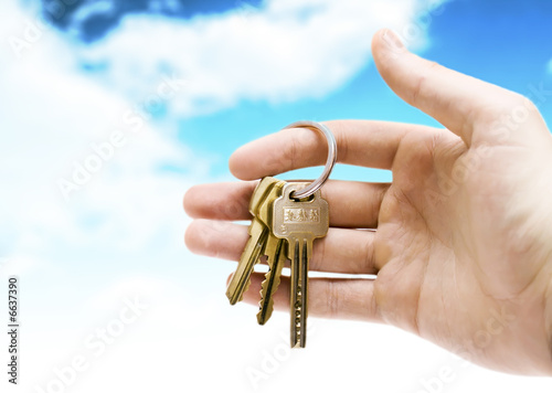 human hand with keys isolated on background
