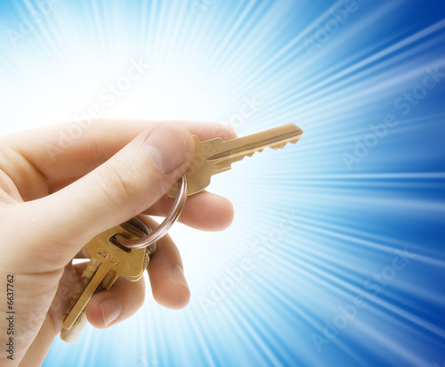 human hand with keys isolated on background