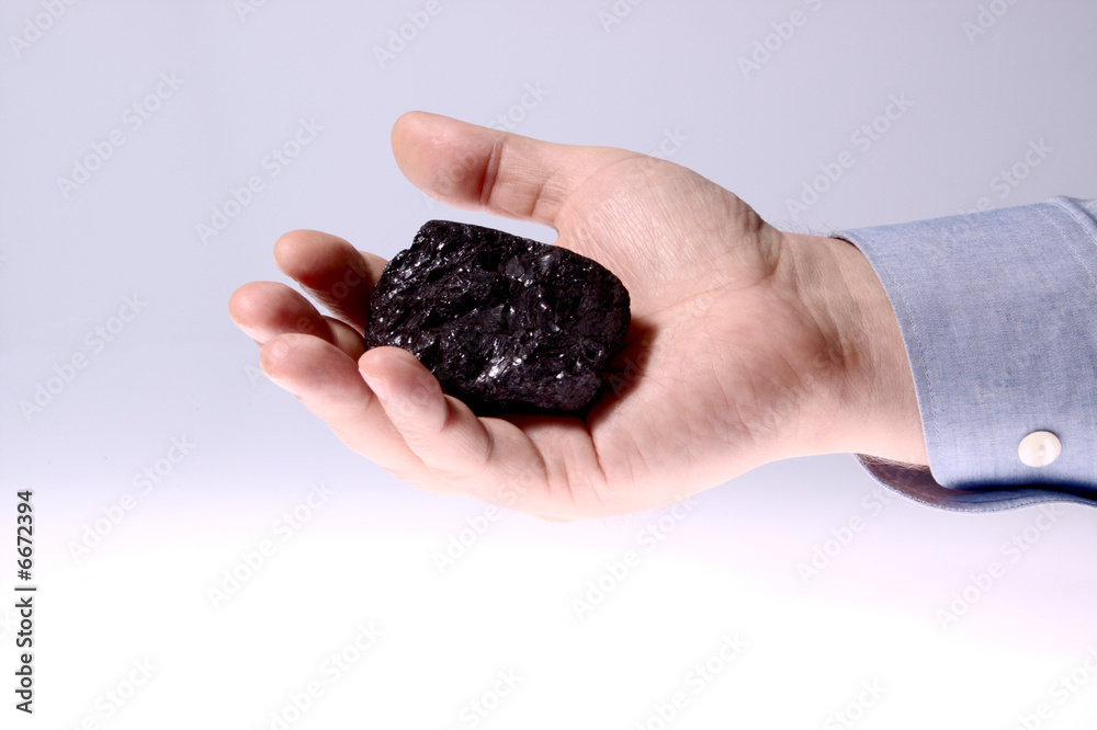 Pieces of coal in palm/ Holding Coal Pieces of coal in palm/ Holding Coal