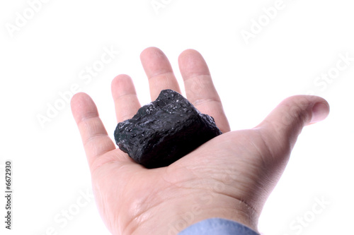 Pieces of coal in palm/ Holding Coal