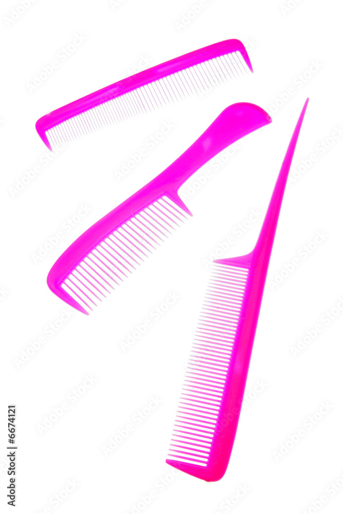 Three pink combs on white background Three pink combs on white background