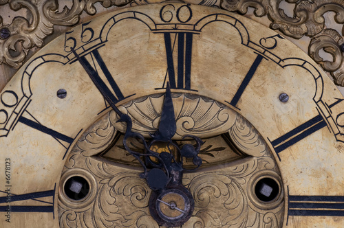 Old clock showing five to twelve