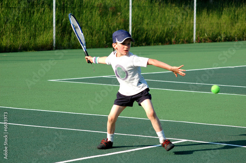 boy playing tennis © jjpixs