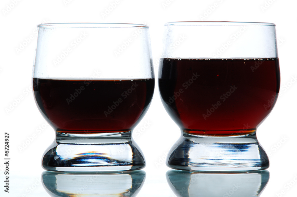 Two Glasses filled with some alcohol Two Glasses filled with some alcohol