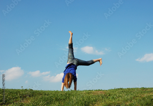 Girl recreation on the green meadow photo