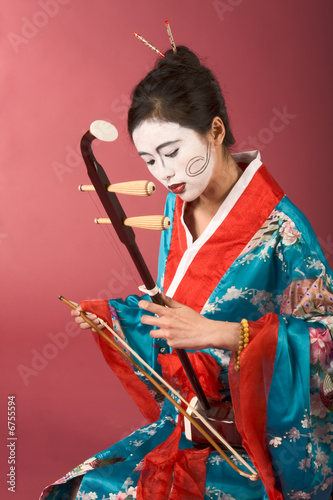 Geisha in kimono with erhu photo