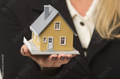 House in Woman's Hands