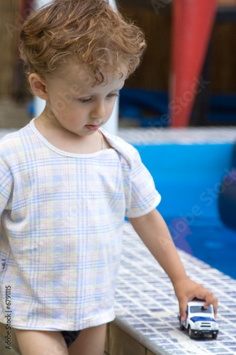 Curly boy at a pool (09)