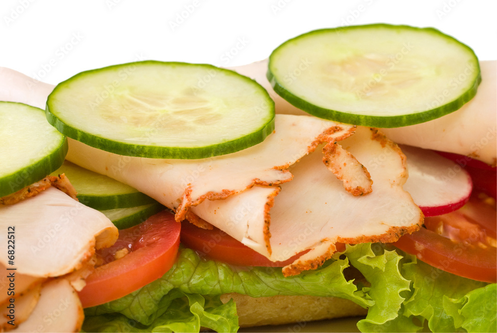 Close up of roasted turkey sandwich on white background Close up of roasted turkey sandwich on white background