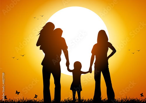Happy family at sunset