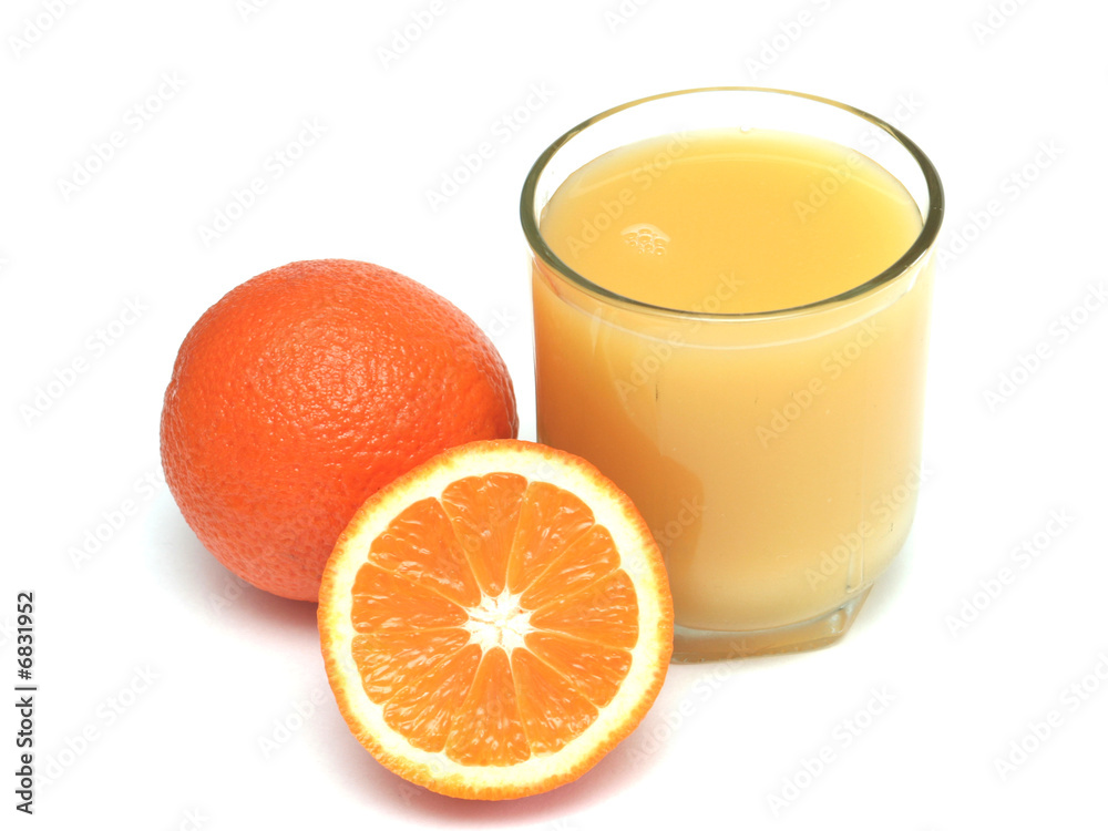 Glass of orange juice and segment of an orange