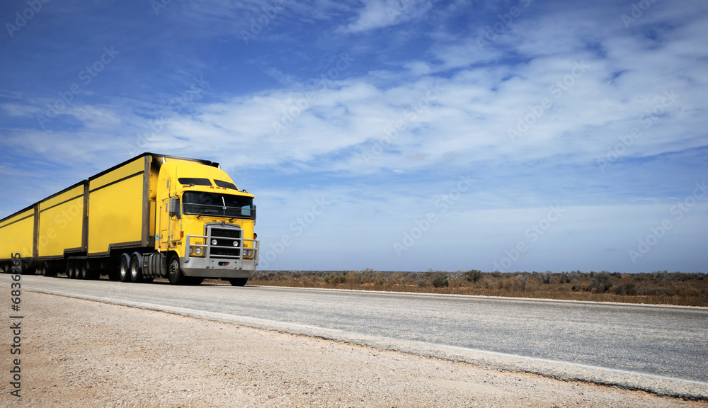 Road train on the Eyre Highway, Nullarbor Plain, South Australia Road train on the Eyre Highway, Nullarbor Plain, South Australia