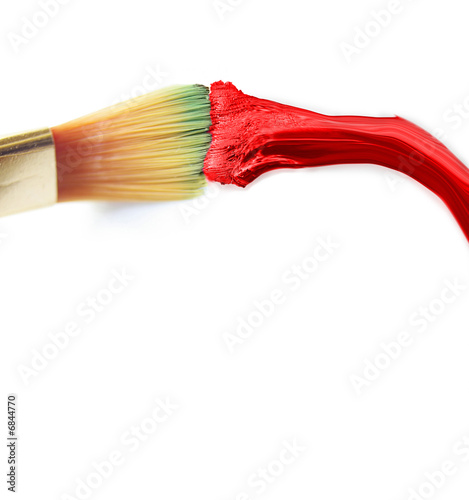 Red paint and brush on white background