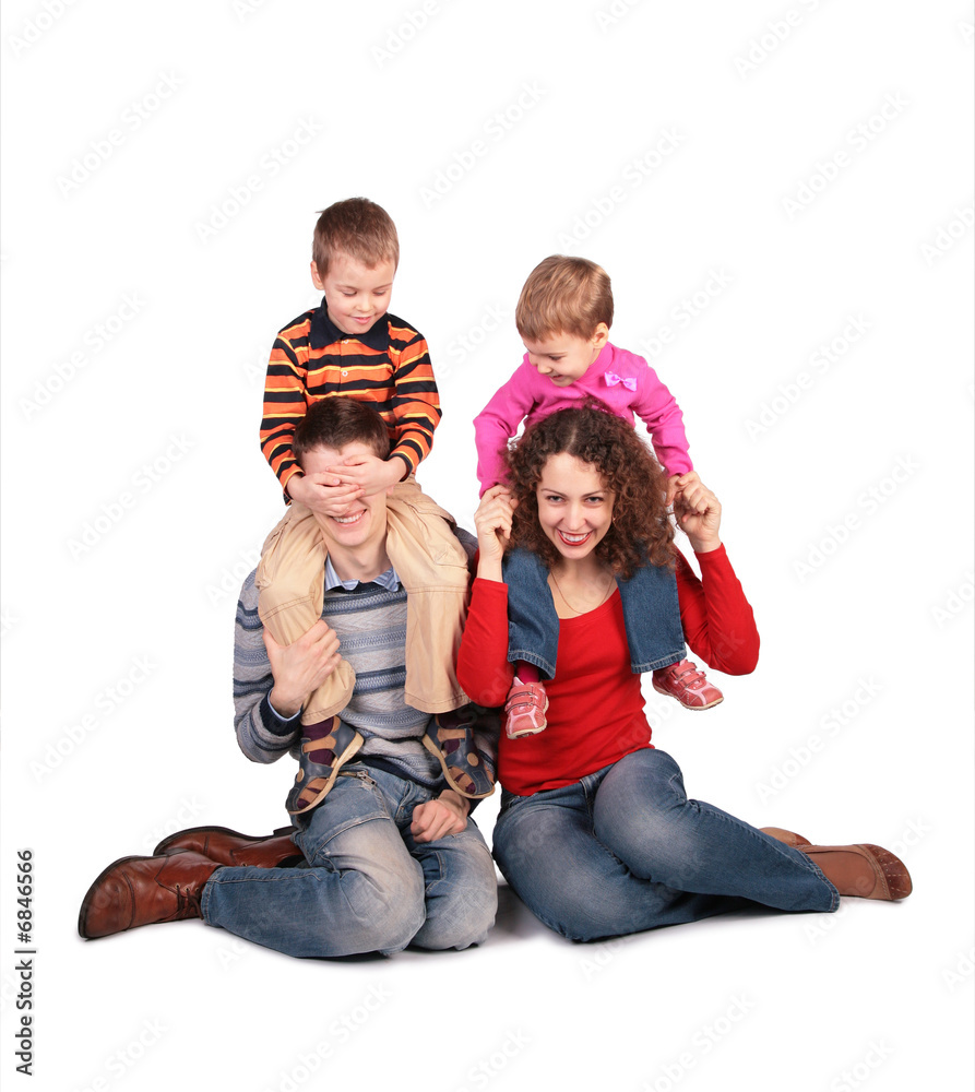parents sit with children on shoulders parents sit with children on shoulders