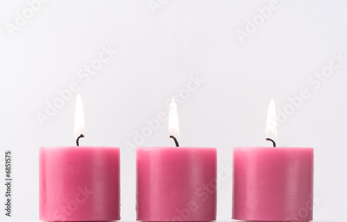 Three pink candles