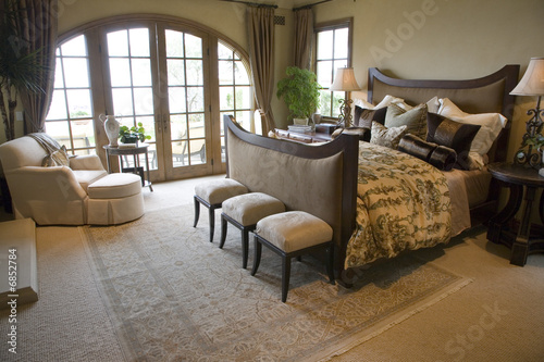 Mansion with comfortable bedroom and luxurious decor.