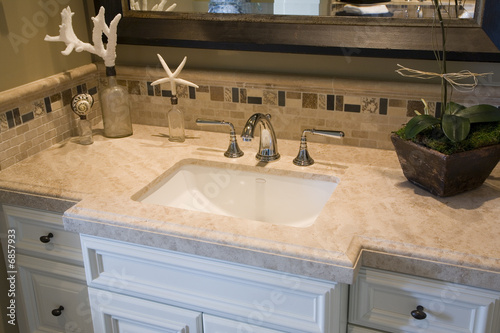 Modern bathroom with a luxurious sink and faucet.