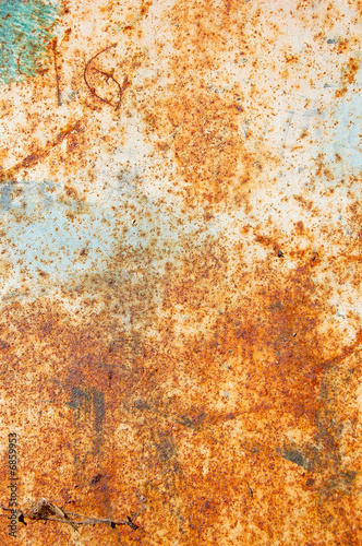 rusty metal surface with peeled paint and etched numbers