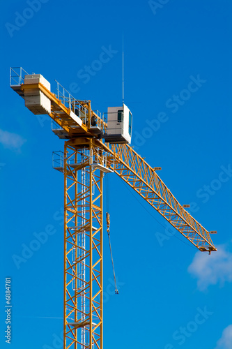 yellow crane in blue sky
