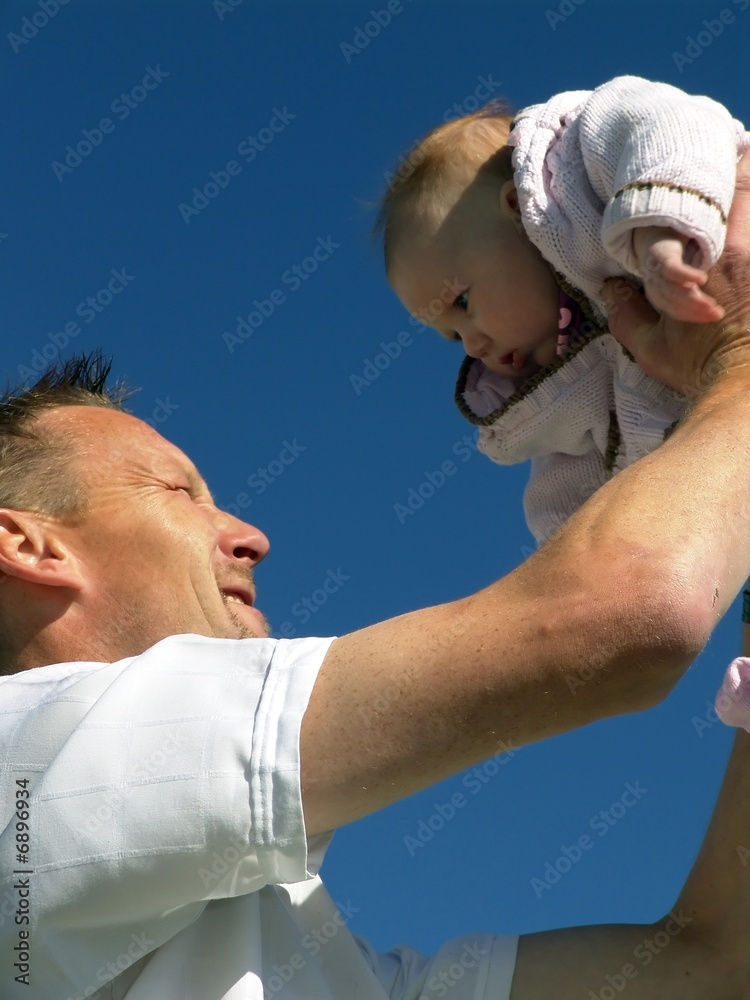 Fototapeta premium .Father hold baby up in the air
